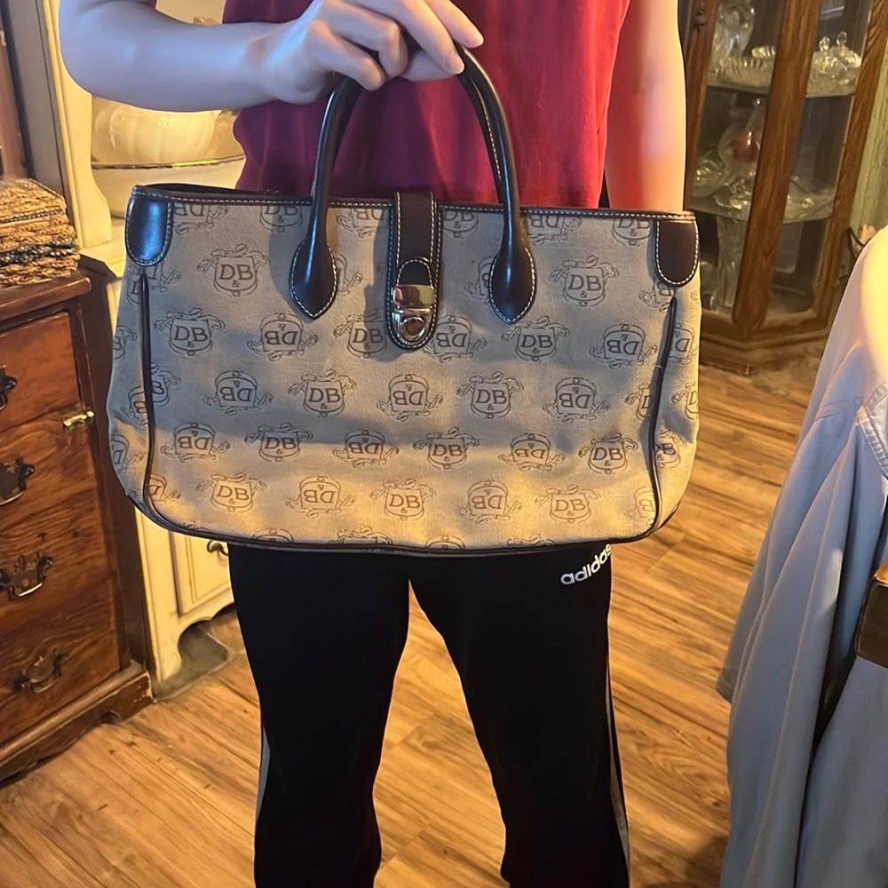 Gently used Dooney and Bourke bag.  Some slight staining.  Excellent shape.